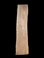 A long walnut wood slab on a black background.