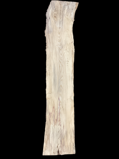 A beige-colored Hackberry wood slab with a natural grain pattern and some knots, isolated on a black background.