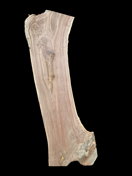 A short walnut slab with a black background.