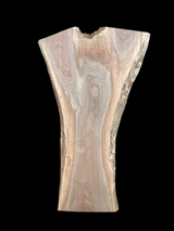 A large walnut slab with a black background.
