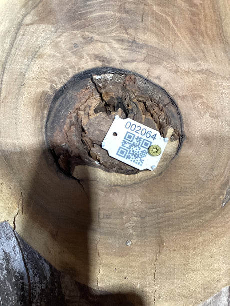 QR label attached to a walnut wood slab.