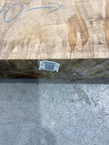 QR label attached to the edge of a red oak slab.