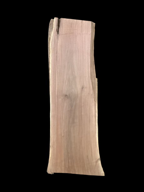 Large walnut wood slab with a black background.