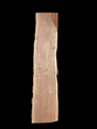 A long walnut wood slab on a black background.