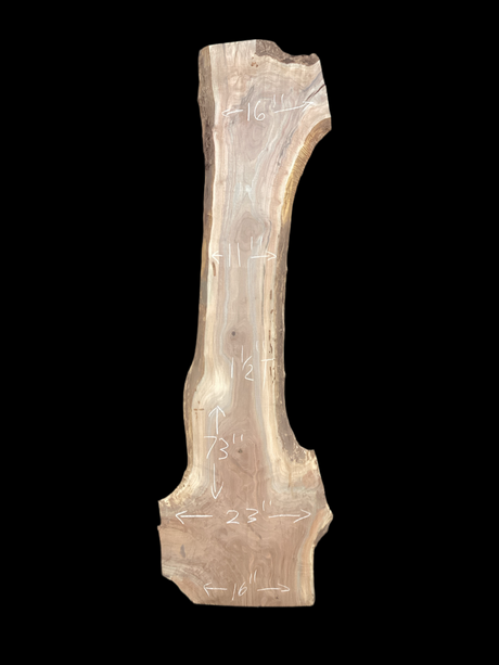 A large walnut slab with a black background.