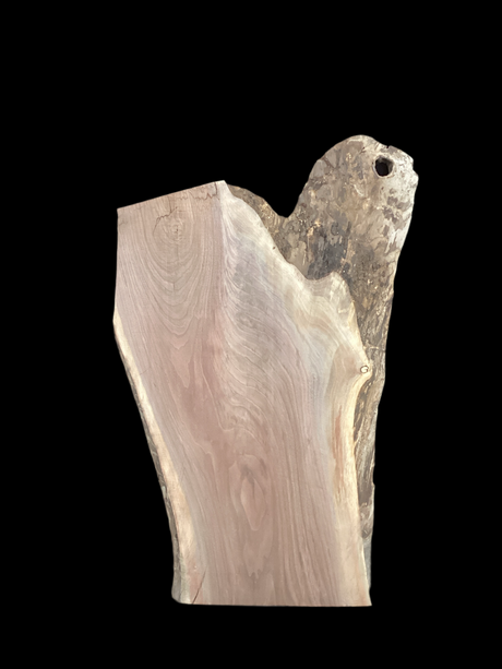 A short walnut slab with a black background.