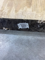 A Silver Maple wood slab edge with QR code attached.