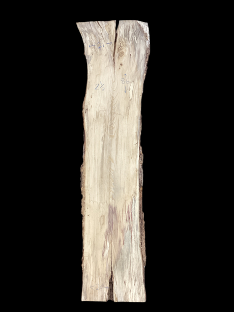 A vertical image of a spalted hackberry wood piece with a distinctive natural pattern. and black background.