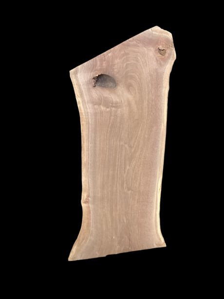 Walnut wood slab with a black background.