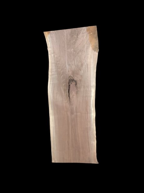 A short walnut slab with a black background. 