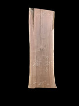 Large walnut wood slab with a black background.