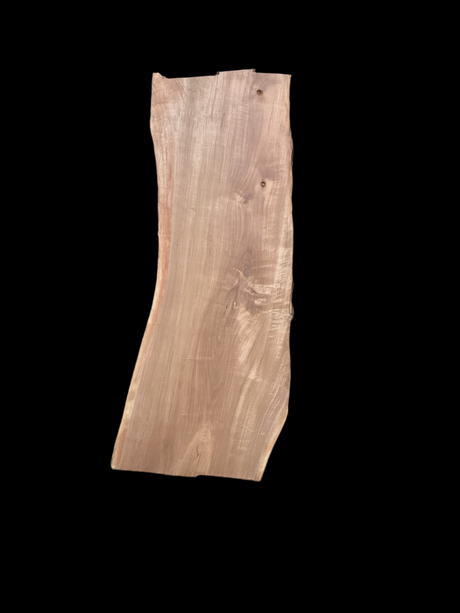 A large walnut slab with a black background.