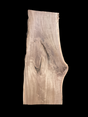 A large walnut slab with a black background.