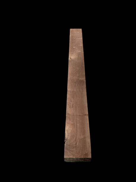 A walnut fireplace mantle with a natural finish, displaying the grain and color of the walnut wood.