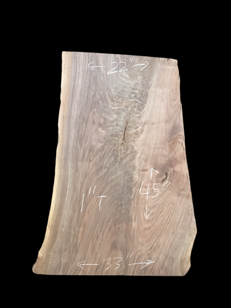 A short walnut slab with a black background.