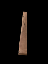 A walnut fireplace mantle with a natural finish, displaying the grain and color of the walnut wood.