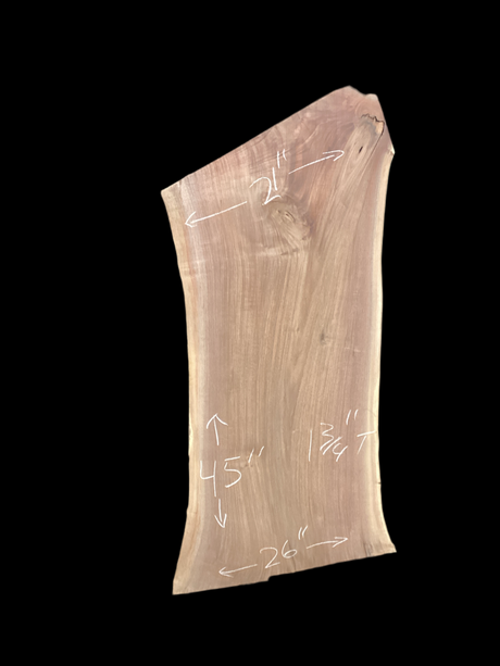 Large walnut wood slab with a black background.