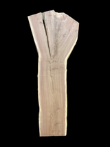 A large walnut slab with a black background.