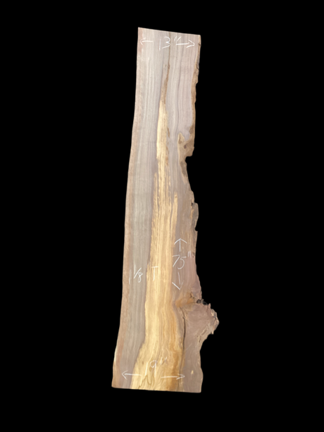 A large walnut slab with a black background.