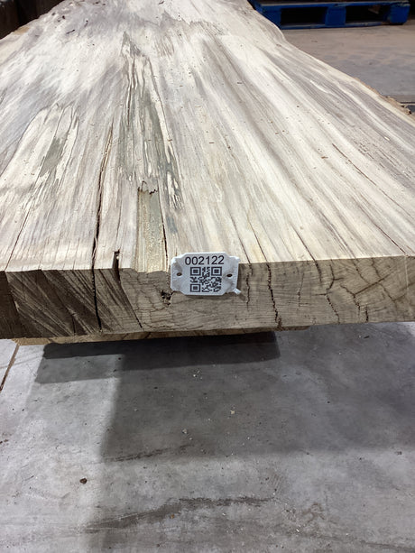 QR label attached to the edge of a Hackberry slab.